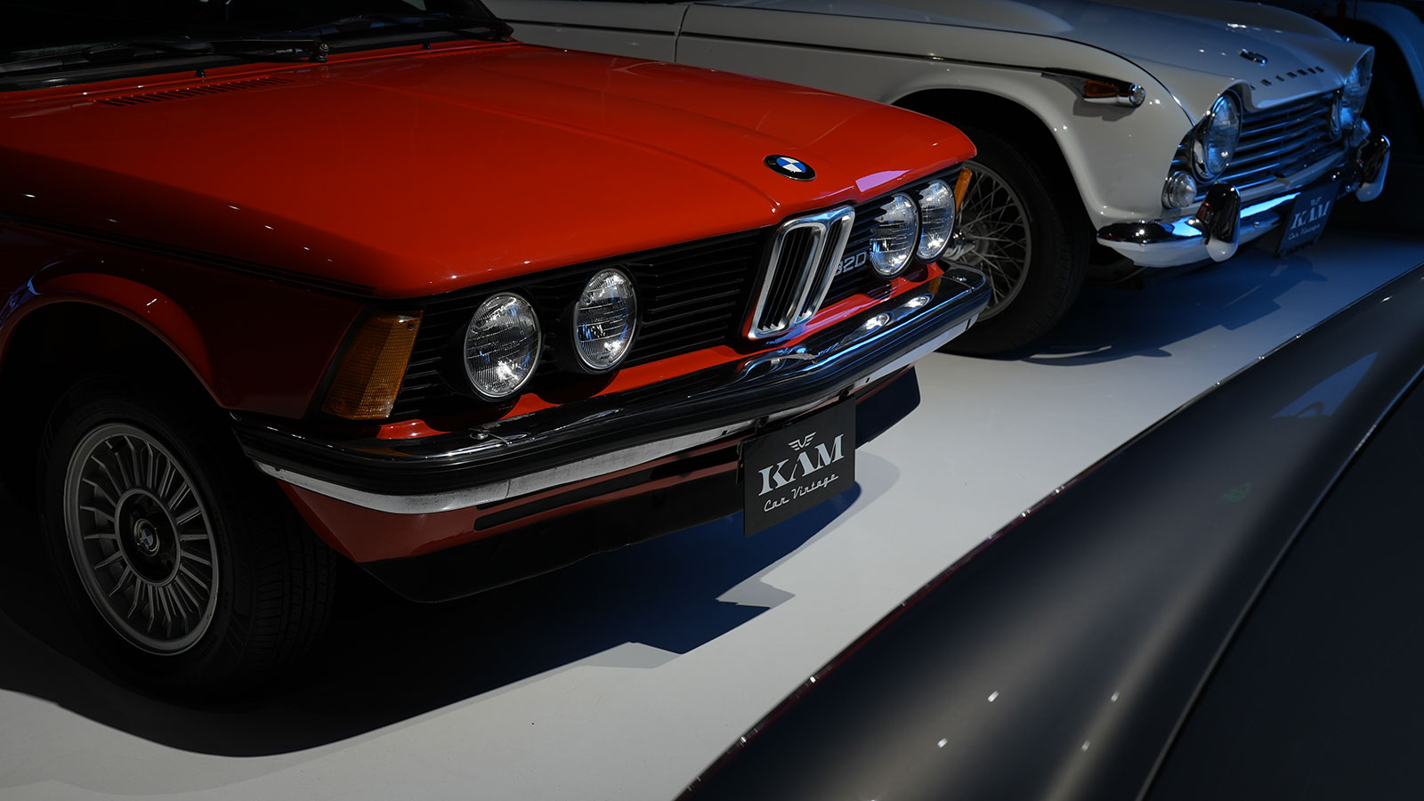Custom plate holder displayed on a classic BMW